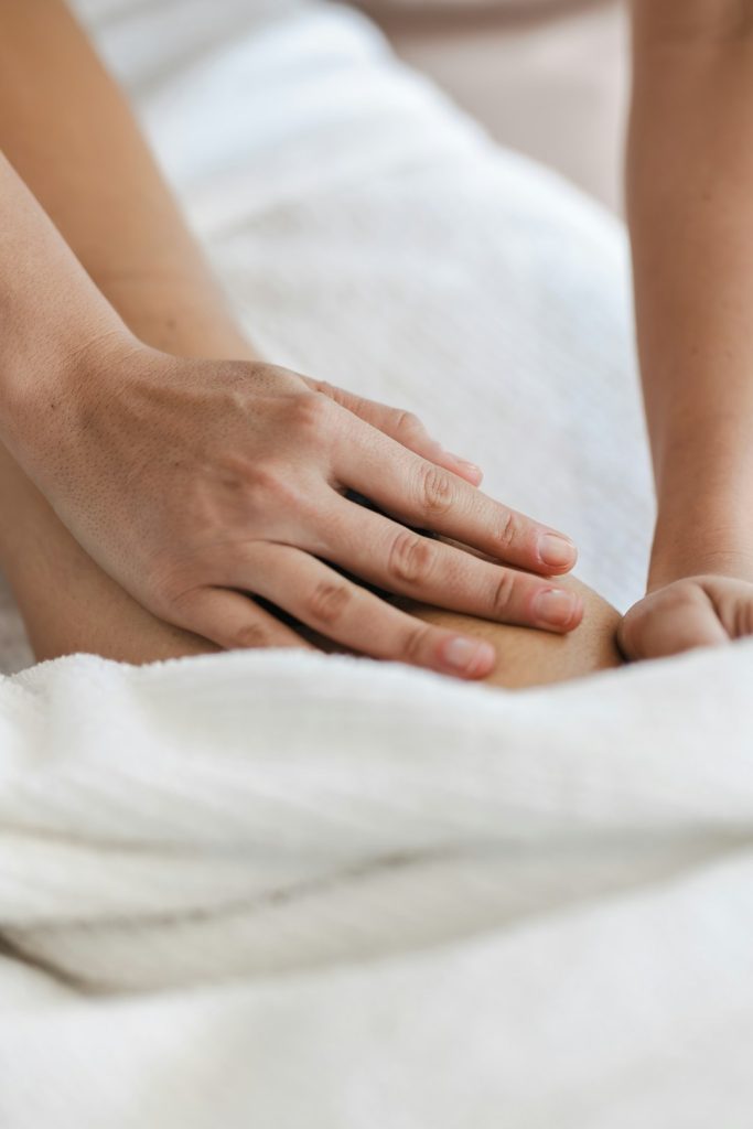 a-close-up-of-a-person-laying-in-a-bed-with-a-towel-ybllznca6gu